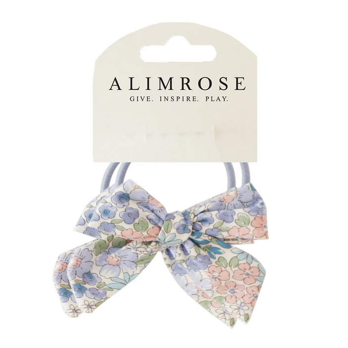 Floral hair bows on a card with 'Alimrose' branding on a white background