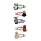 Set of Halloween-themed hair clips on a white background