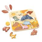 Wooden dinosaur puzzle with pieces on a white background