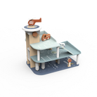 A wooden toy multi-level parking garage playset with a light blue and beige design, featuring small toy cars and a helicopter, shown on a plain white background.