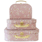 Set of three pink floral-patterned suitcases with gold handles on a white background
