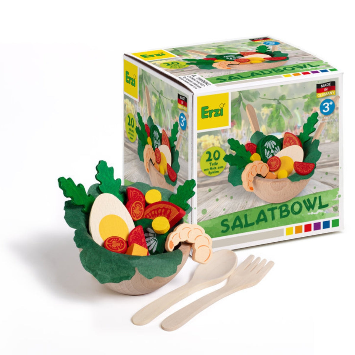 Wooden salad bowl set with toy vegetables and utensils in front of its packaging.