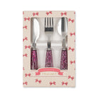 Set of cutlery with purple handles in a decorative box on a white background