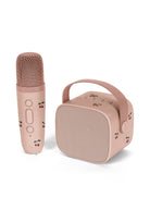 A pink portable karaoke microphone and matching speaker set with cherry illustrations, shown on a clean white background.