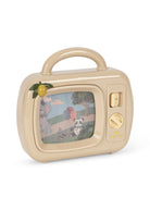 A retro-style beige toy television with a handle, featuring a colorful screen showing a panda and landscape, with a small yellow fruit decoration on the side, set against a plain white background.