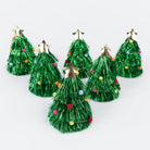 Set of six green tinsel Christmas trees with star toppers on a white background
