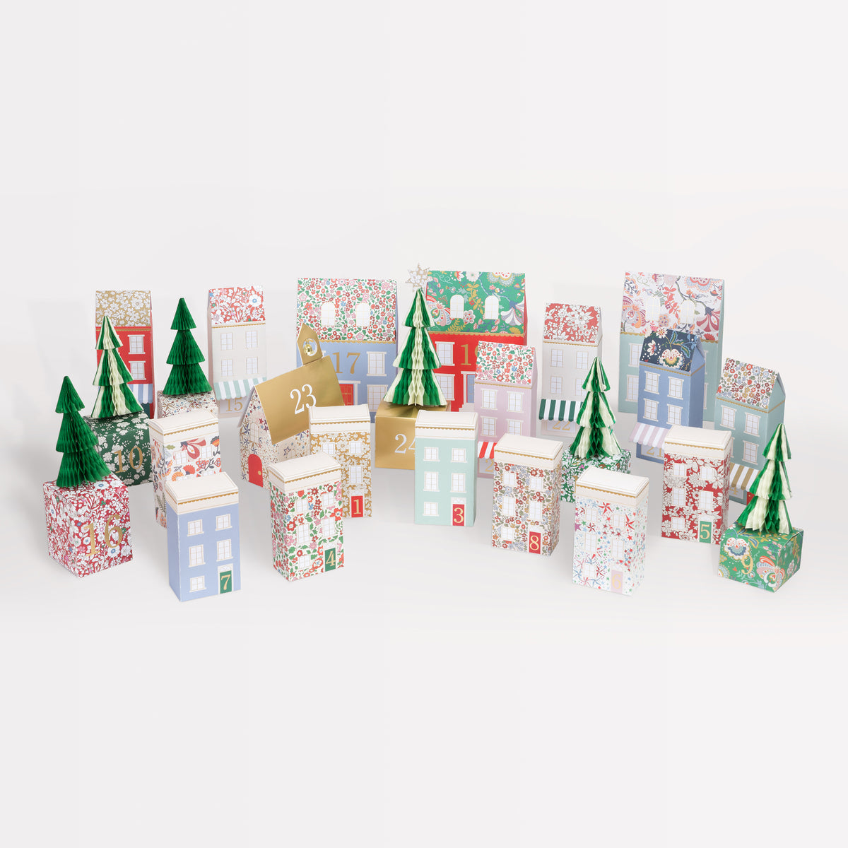 Decorative advent calendar with houses and trees on a white background