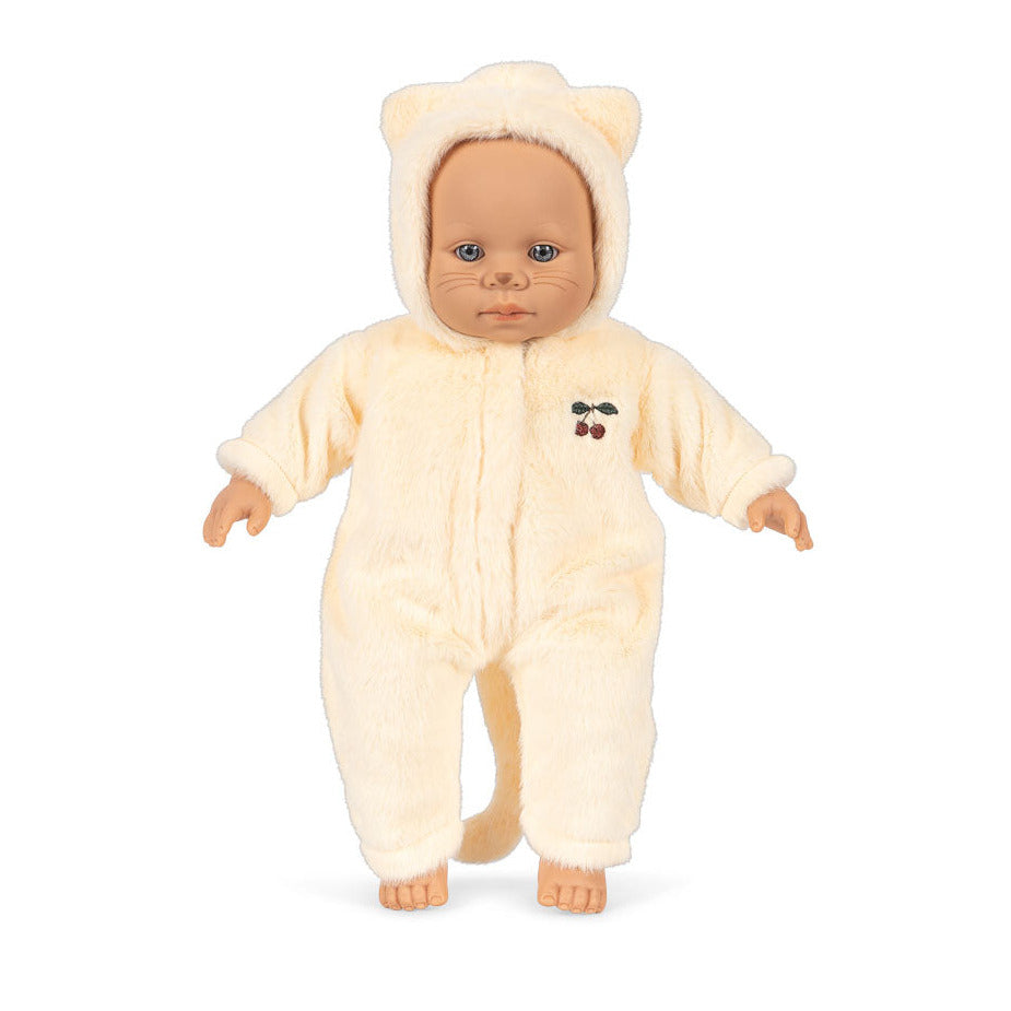 Doll wearing a cream-colored bear onesie on a white background