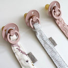 LOVE THIS! Cam Cam Pacifier Holder - GOTS - Pressed Leaves Rose from CamCam - shop at littlewhimsy NZ