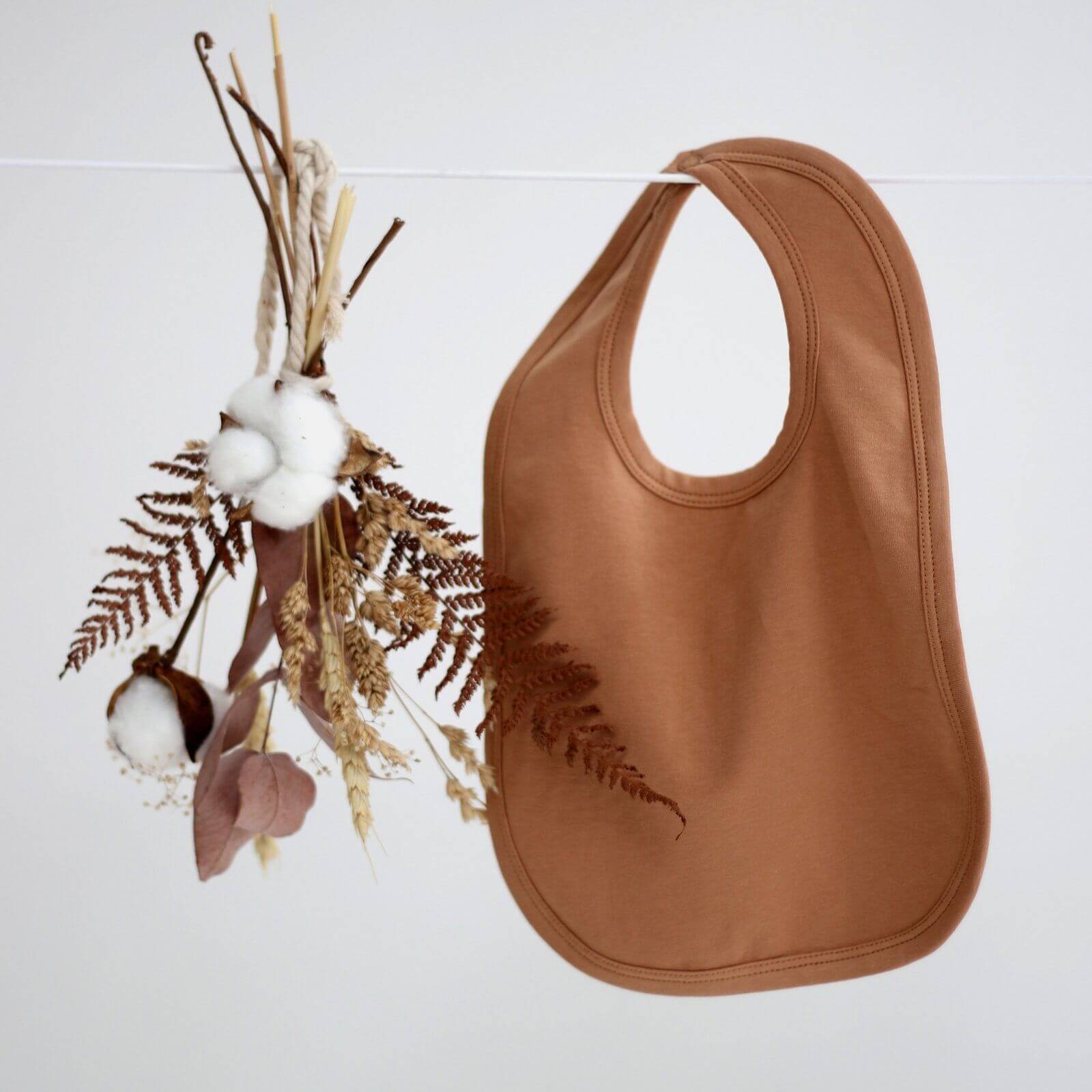 LOVE THIS! Essentials Bib - Almond Tawny Brown from Burrow & Be - shop at littlewhimsy NZ