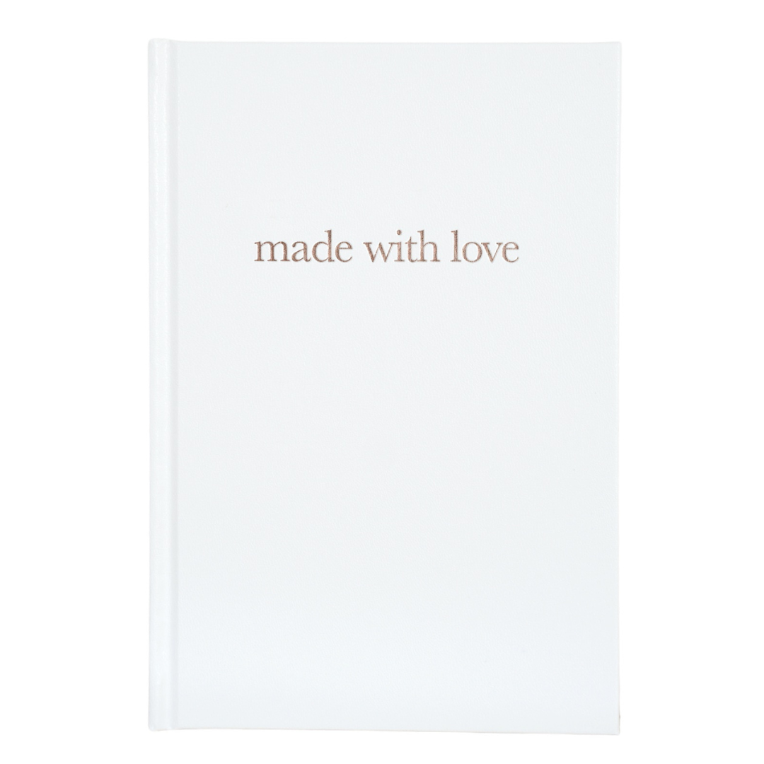 A white Pregnancy Journal with the title 'made with love' printed in gold lettering on the cover.